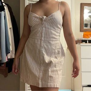 Abercrombie women’s white and cream striped dress.